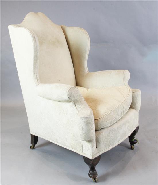 A 1920s Georgian style mahogany wing armchair H. 3ft 8in.